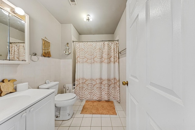 2443 N Marshfield Ave, Chicago, IL 60614 - bathroom with toilet, tile patterned floors, vanity, and curtained shower