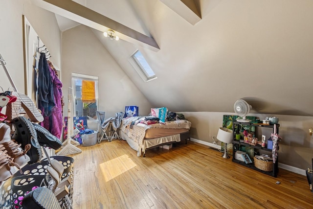2443 N Marshfield Ave, Chicago, IL 60614 - bedroom featuring a skylight, vaulted ceiling, hardwood / wood-style floors, and baseboards