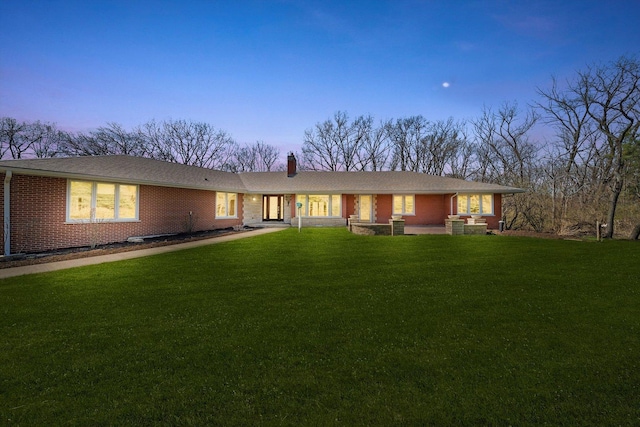 16608 W 135th St, Lemont, IL 60439 - ranch-style house with a yard, brick siding, a chimney, and a porch