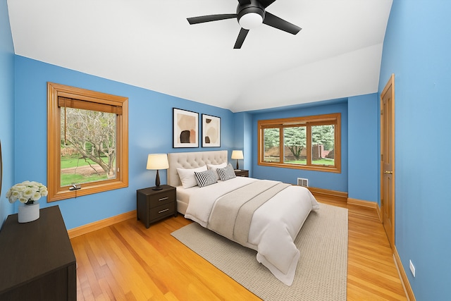 16608 W 135th St, Lemont, IL 60439 - bedroom with multiple windows, light wood finished floors, baseboards, and lofted ceiling