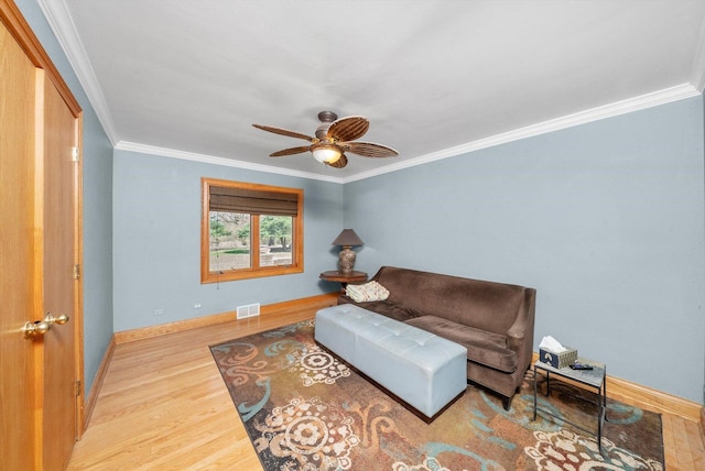 16608 W 135th St, Lemont, IL 60439 - living area featuring crown molding, wood finished floors, ceiling fan, and baseboards