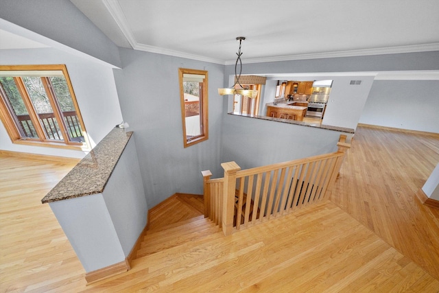 16608 W 135th St, Lemont, IL 60439 - stairway featuring wood finished floors, baseboards, and crown molding
