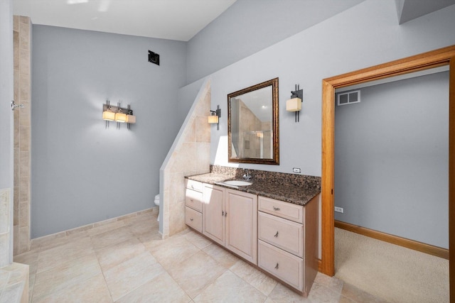 16608 W 135th St, Lemont, IL 60439 - bathroom with vanity, toilet, tiled shower, tile patterned floors, and baseboards