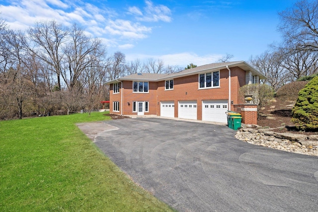 16608 W 135th St, Lemont, IL 60439 - view of front of home featuring asphalt driveway, an attached garage, brick siding, and a front lawn