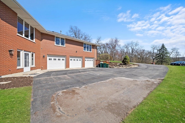 16608 W 135th St, Lemont, IL 60439 - view of property exterior with driveway, a garage, and brick siding