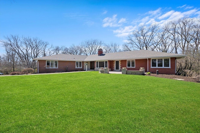 16608 W 135th St, Lemont, IL 60439 - ranch-style house featuring brick siding, a front yard, and a chimney