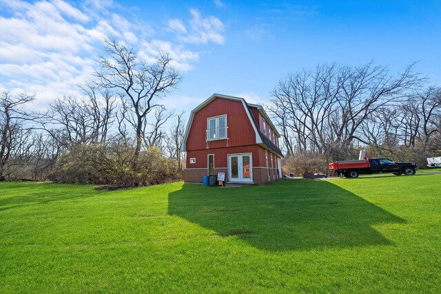 16608 W 135th St, Lemont, IL 60439 - view of home's exterior with a gambrel roof, a lawn, and french doors