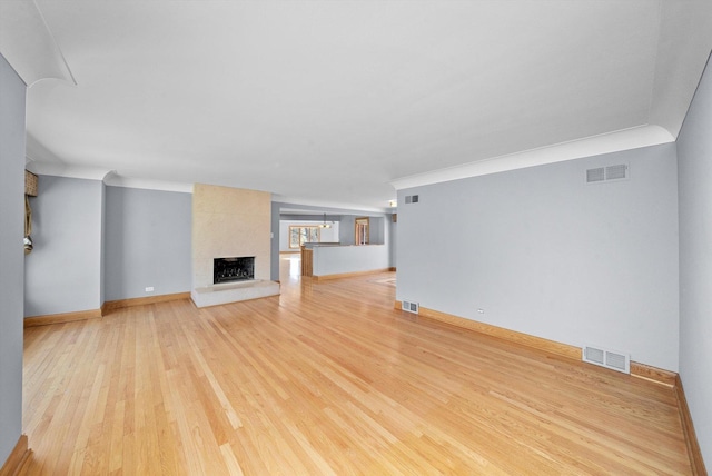 16608 W 135th St, Lemont, IL 60439 - unfurnished living room with light wood-type flooring, baseboards, a large fireplace, and crown molding