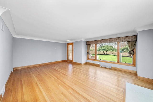 16608 W 135th St, Lemont, IL 60439 - unfurnished living room featuring light wood-style floors, ornamental molding, and baseboards