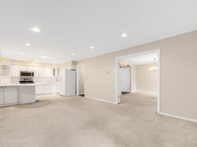 1409 Burr Oak Rd Unit 109A, Hinsdale, IL 60521 - unfurnished living room featuring baseboards, light carpet, a chandelier, and recessed lighting
