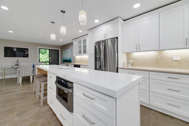 1409 Burr Oak Rd Unit 109A, Hinsdale, IL 60521 - kitchen featuring appliances with stainless steel finishes, decorative backsplash, glass insert cabinets, recessed lighting, and decorative light fixtures