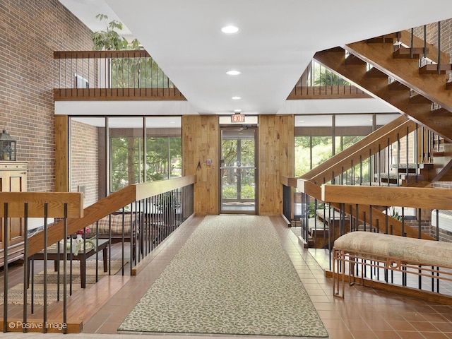 1409 Burr Oak Rd Unit 109A, Hinsdale, IL 60521 - community lobby with a high ceiling, recessed lighting, wooden walls, and stairway