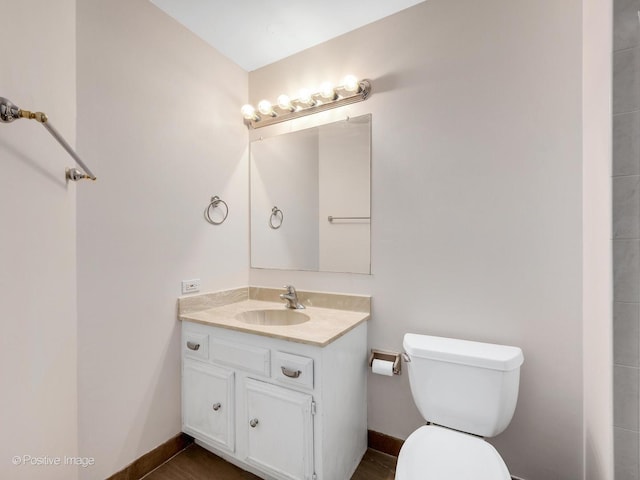 1409 Burr Oak Rd Unit 109A, Hinsdale, IL 60521 - bathroom featuring toilet, vanity, and baseboards