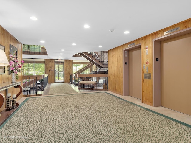 1409 Burr Oak Rd Unit 109A, Hinsdale, IL 60521 - hall with elevator, wood walls, stairway, and recessed lighting