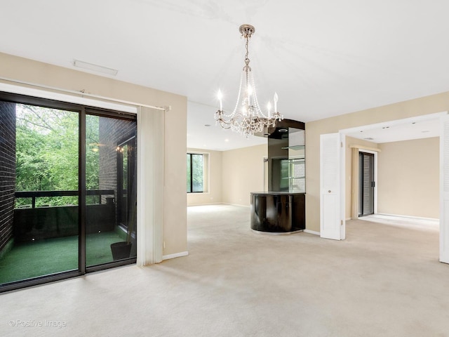 1409 Burr Oak Rd Unit 109A, Hinsdale, IL 60521 - carpeted empty room with a chandelier and baseboards