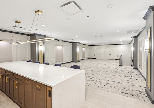kitchen with recessed lighting, ornamental molding, light carpet, open floor plan, and light countertops