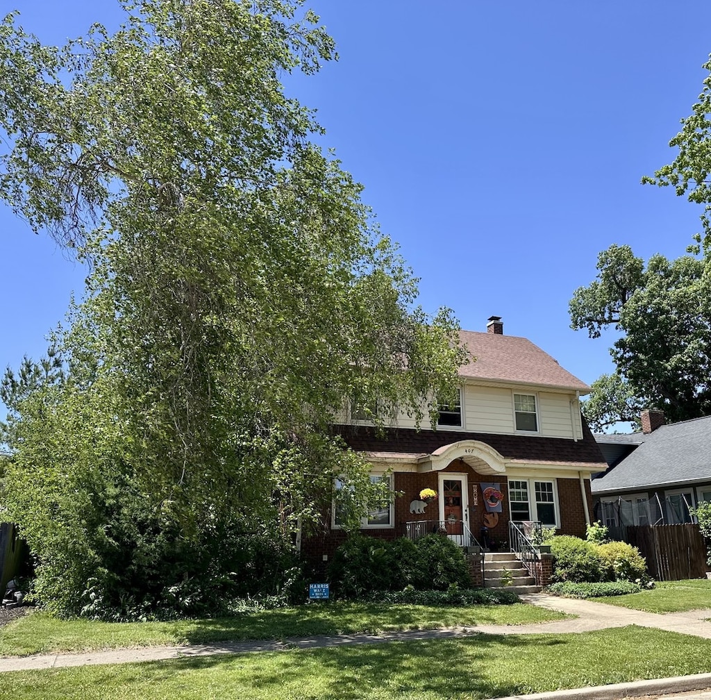 407 4th Ave, Ottawa, IL 61350 - view of front of property featuring a front lawn, brick siding, and a chimney