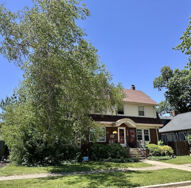 407 4th Ave, Ottawa, IL 61350 - view of front of property featuring a front lawn, brick siding, and a chimney