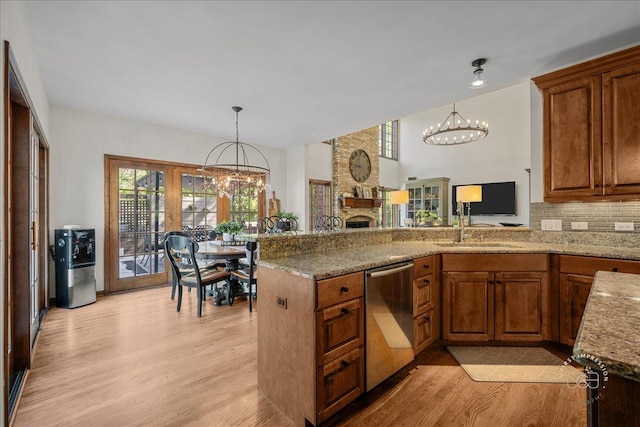 3722 Saint Germain Pl, Saint Charles, IL 60175 - kitchen featuring stainless steel dishwasher, a chandelier, light wood finished floors, and brown cabinetry