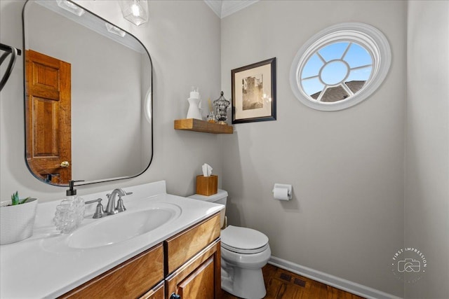 3722 Saint Germain Pl, Saint Charles, IL 60175 - half bathroom featuring toilet, vanity, baseboards, and ornamental molding