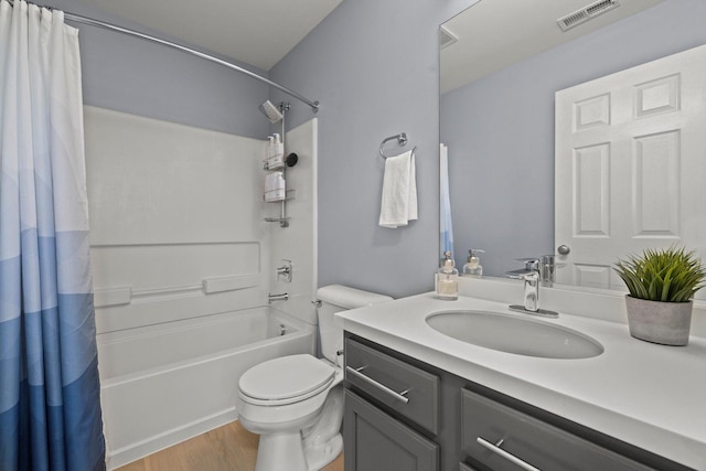 698 S Jade Ln Unit 698, Round Lake, IL 60073 - full bath featuring wood finished floors, shower / bath combo with shower curtain, toilet, and vanity