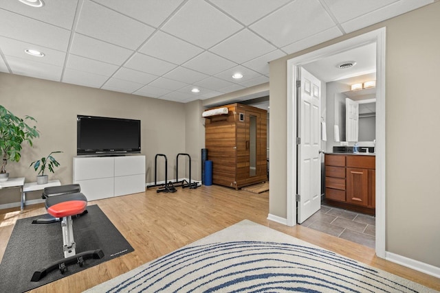 698 S Jade Ln Unit 698, Round Lake, IL 60073 - workout room with light wood-style floors, a paneled ceiling, baseboards, and recessed lighting