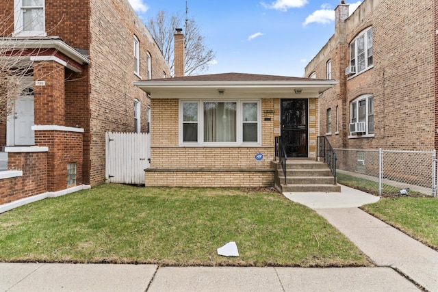 733 E 90th St, Chicago, IL 60619 - view of front facade with brick siding and a chimney