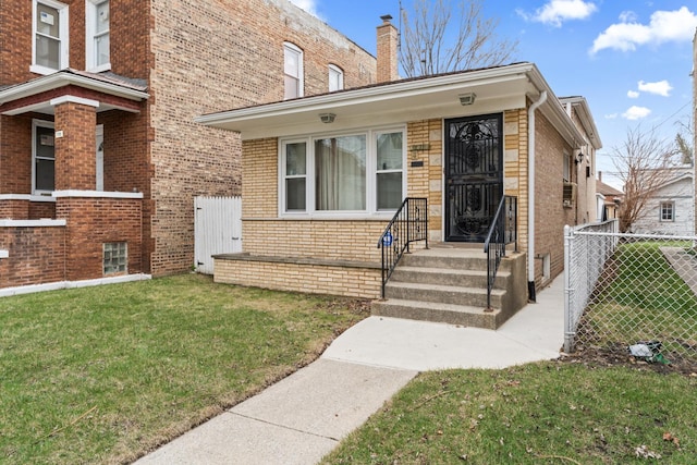 733 E 90th St, Chicago, IL 60619 - view of front of home featuring brick siding and a chimney
