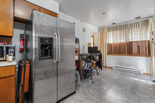 733 E 90th St, Chicago, IL 60619 - kitchen with stainless steel appliances, baseboard heating, and brown cabinetry
