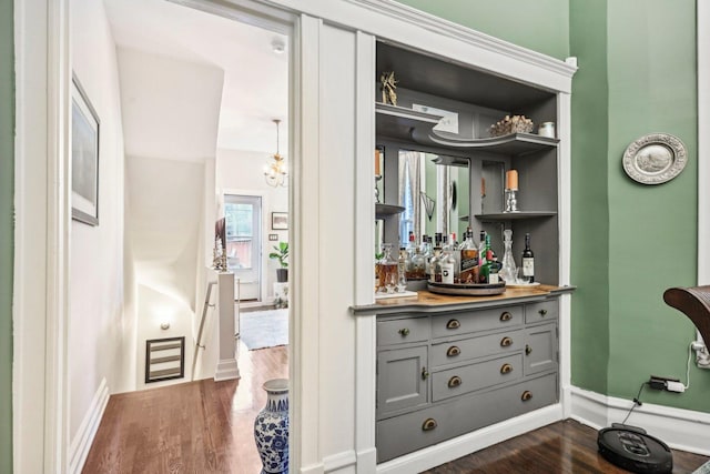 4914 S Washington Park Ct, Chicago, IL 60615 - indoor dry bar featuring dark wood-style flooring and baseboards