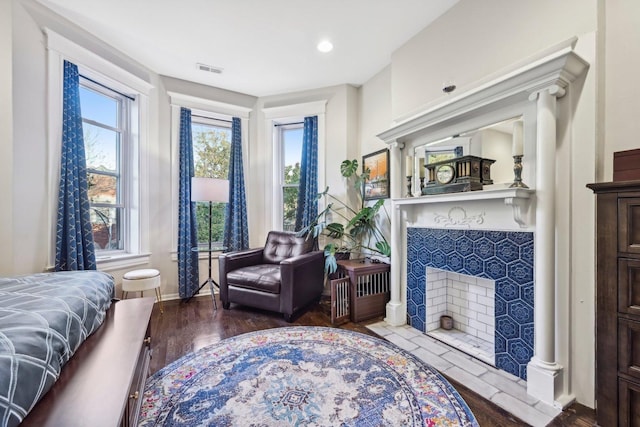 4914 S Washington Park Ct, Chicago, IL 60615 - bedroom featuring baseboards, wood finished floors, a tile fireplace, and recessed lighting