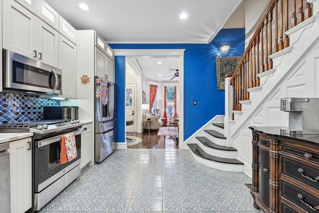 4914 S Washington Park Ct, Chicago, IL 60615 - kitchen featuring stainless steel appliances, a ceiling fan, backsplash, white cabinetry, and recessed lighting