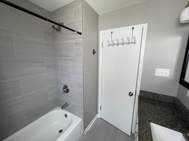 full bath with shower / bath combination and baseboards