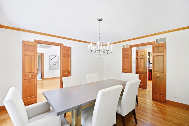 24 Robin Crest Rd, Hawthorn Woods, IL 60047 - dining space featuring a chandelier, light wood-type flooring, crown molding, and baseboards