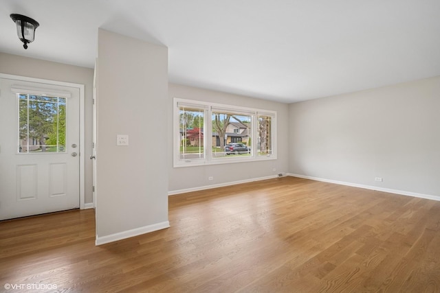 521 N Greenwood Dr, Palatine, IL 60074 - unfurnished room with plenty of natural light, baseboards, and light wood-style floors
