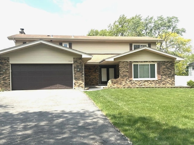 1402 Berry Ln, Flossmoor, IL 60422 - view of front of house featuring a garage, concrete driveway, brick siding, and a front yard