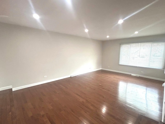 1402 Berry Ln, Flossmoor, IL 60422 - spare room with dark wood-type flooring, baseboards, and recessed lighting
