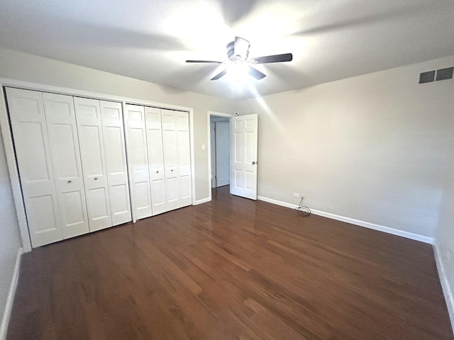 1402 Berry Ln, Flossmoor, IL 60422 - unfurnished bedroom with baseboards, dark wood-style floors, a closet, and a ceiling fan