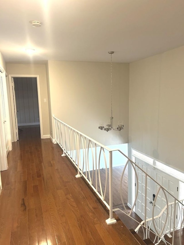 1402 Berry Ln, Flossmoor, IL 60422 - hall featuring dark wood-style flooring, an upstairs landing, a chandelier, and baseboards