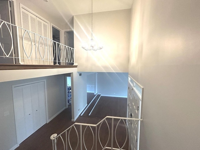 1402 Berry Ln, Flossmoor, IL 60422 - stairway with wood finished floors, a chandelier, and baseboards