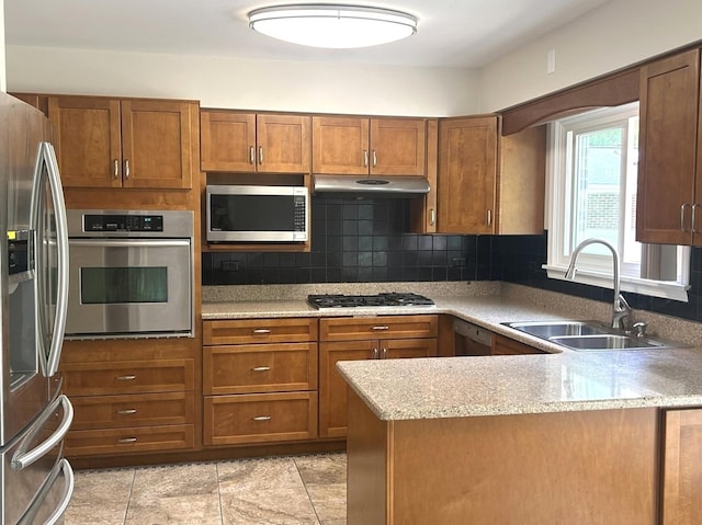 1402 Berry Ln, Flossmoor, IL 60422 - kitchen featuring appliances with stainless steel finishes, a sink, decorative backsplash, and brown cabinets