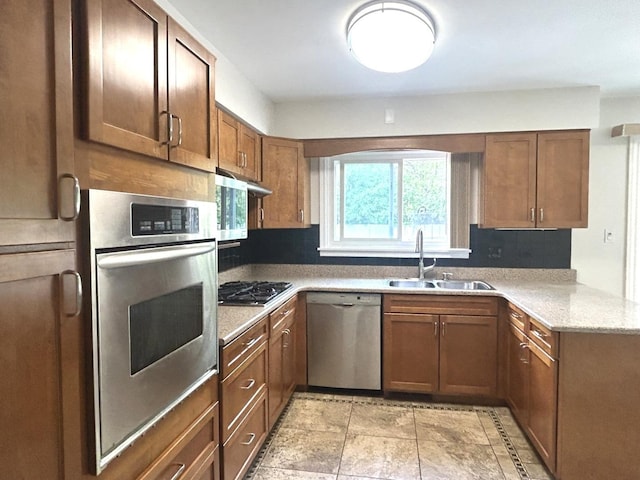 1402 Berry Ln, Flossmoor, IL 60422 - kitchen featuring stainless steel appliances, a sink, brown cabinets, and a peninsula
