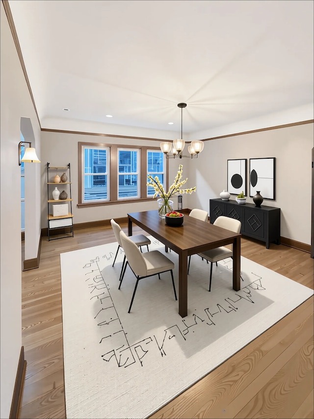 dining area with baseboards, a chandelier, light wood-style floors, and recessed lighting