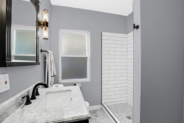 full bathroom featuring a shower stall, marble look tile flooring, vanity, and toilet