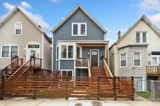 3104 N Sacramento Ave, Chicago, IL 60618 - view of front of home featuring a gate, a fenced front yard, stairs, and a porch