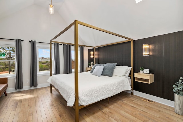 3104 N Sacramento Ave, Chicago, IL 60618 - bedroom featuring light wood-style floors, high vaulted ceiling, and baseboards