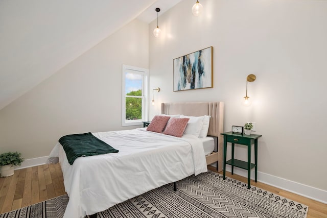 3104 N Sacramento Ave, Chicago, IL 60618 - bedroom featuring wood finished floors, baseboards, and lofted ceiling