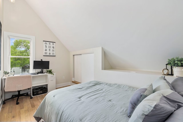 3104 N Sacramento Ave, Chicago, IL 60618 - bedroom featuring lofted ceiling, light wood-style flooring, an office area, and baseboards