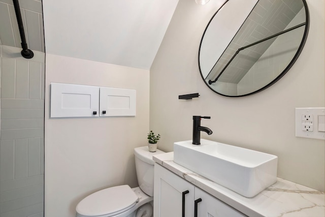 3104 N Sacramento Ave, Chicago, IL 60618 - bathroom featuring toilet, vanity, lofted ceiling, and a tile shower