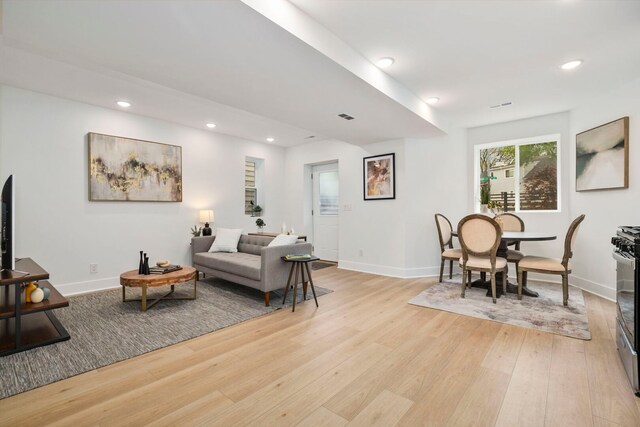 3104 N Sacramento Ave, Chicago, IL 60618 - living room with light wood-style floors, baseboards, and recessed lighting